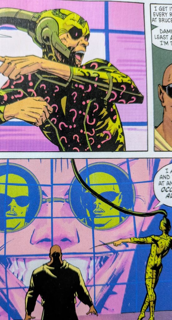 Absolute Riddler hooked up to a machine with giant screen while Waylon Jones looks on.