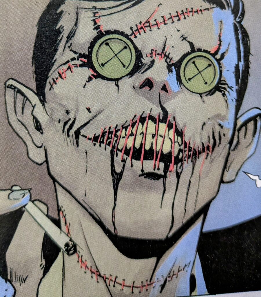 A close-up of Absolute Scarecrow, or straw man. His eyes appear as buttons. His face, neck, and mouth are stitched up with red stiches.