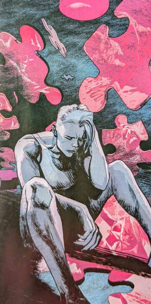 Absolute Black Canary on the floor with a hand on her head while red puzzle pieces, mostly containing the carnage of Absolute Green Arrow, fall around her.