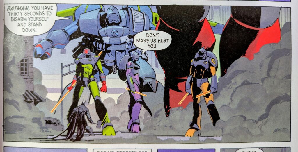 The Absolute Robin team in their suits telling Batman not to make them hurt him.