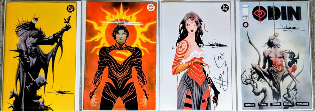 Jay Lee signed comic book covers. Absolute Batman #1, Absolute Superman #1, Absolute Wonder Woman #1 reprints and the 1:100 ratio cover of Odin #1.