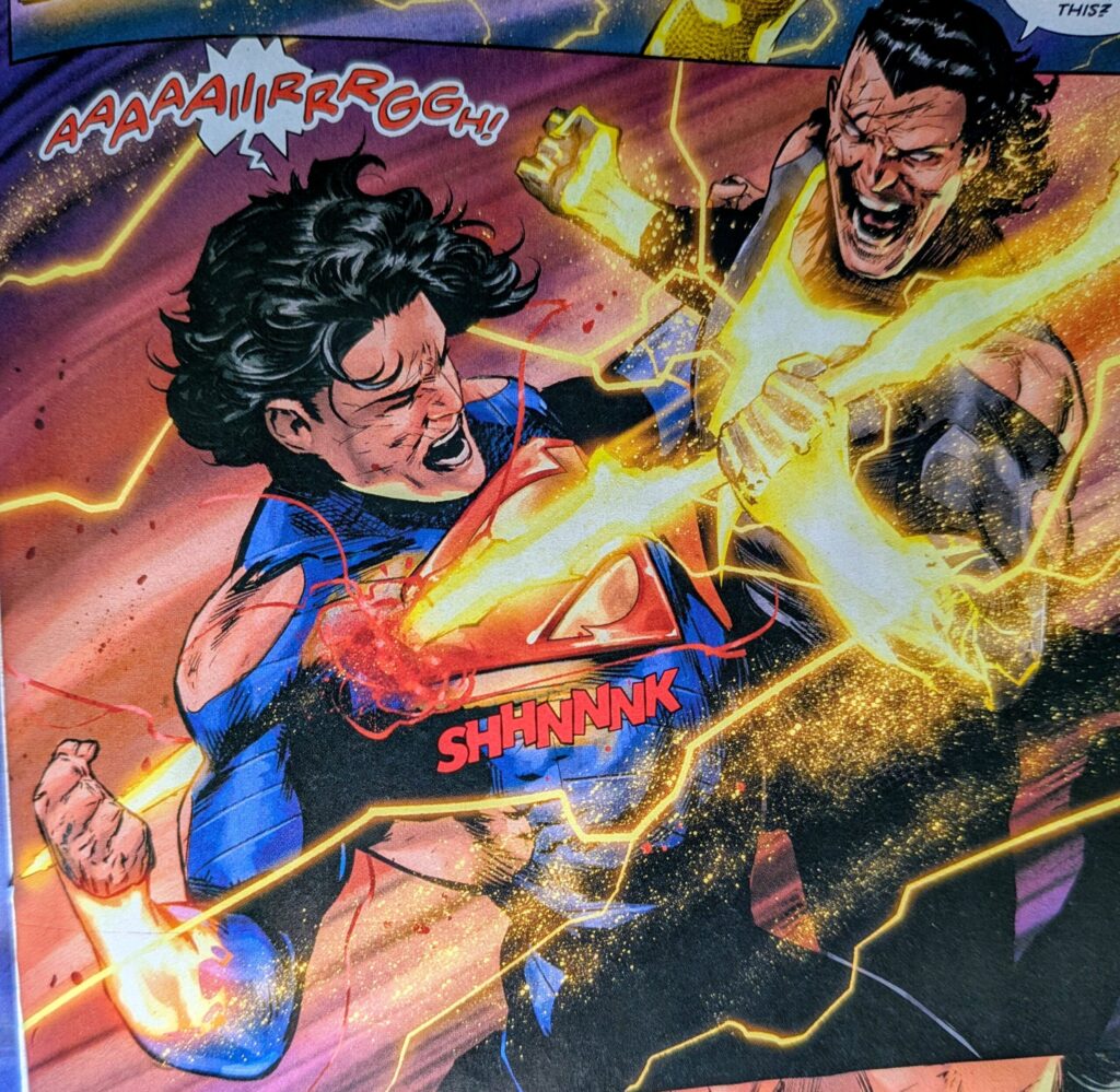Absolute King Shazam stabs Absolute Superman with a lightening bolt.