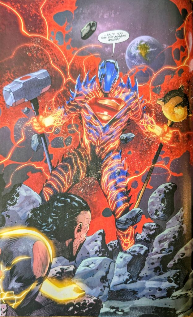 Absolute superman wrapped in his dust from his homeland cape radiating red lightening while wearing spiky superman armor holding Absolute John Henry Iron's hammer and Absolute Hawkman's mace above Absolute King Shazam. He is telling him to say the Magic Word.