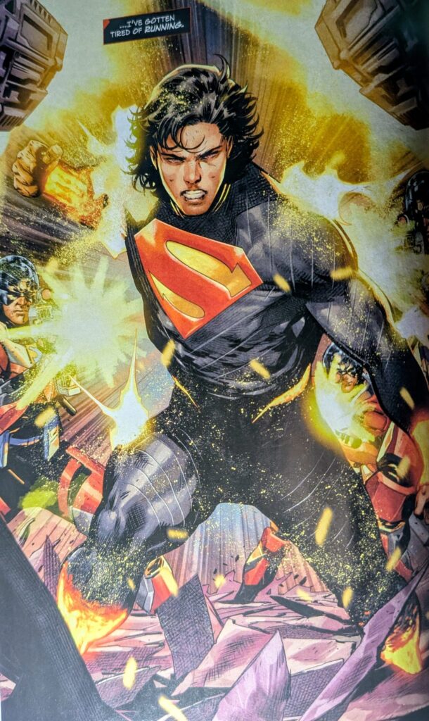 The first fully suited, full page, view of Kal-El or Absolute Superman being shot at by Lazarus peace keepers stating that he is tired of running before fighting back.