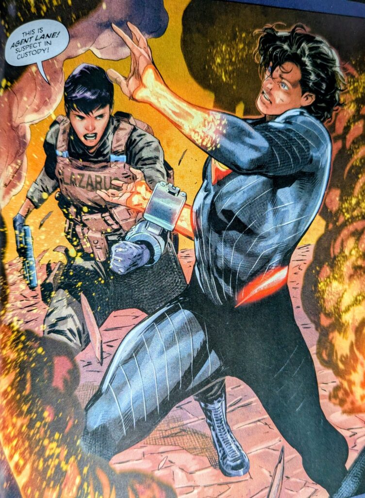 Absolute Superman caught off guard as an agent Lane (Absolute Lois Lane) slaps a shackle on his wrist before calling him Superman for the first time.