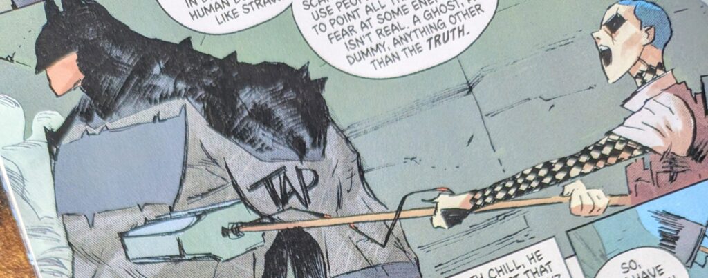 Absolute Harley Quinn hits Absolute Batman with her large hammer to get him to listen.