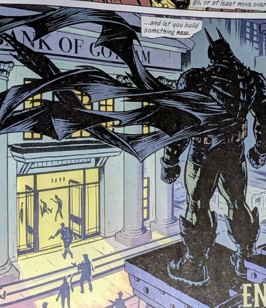 Absolute Batman watching the bank robbers enter the bank from across the street on a roof top.