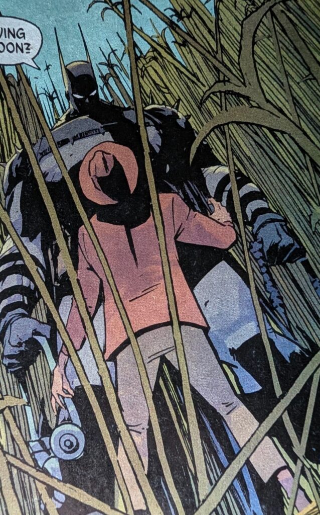 Absolute Batman towering over Absolute Scarecrow in a cornfield.
